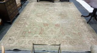 Light green ground rug with foliate decoration, cr