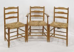 Six Shaker style hardwood ladderback chairs, viz:- pair elbow chairs and four standard chairs,