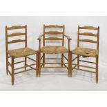Six Shaker style hardwood ladderback chairs, viz:- pair elbow chairs and four standard chairs,