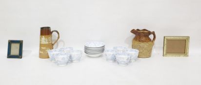 Eight Worcester-style porcelain teacups and saucers, pale blue 'Willow' pattern, pseudo seal mark to