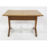 Oak small rectangular centre table, the top with cavetto mould edge, on channelled end standard