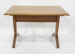 Oak small rectangular centre table, the top with cavetto mould edge, on channelled end standard