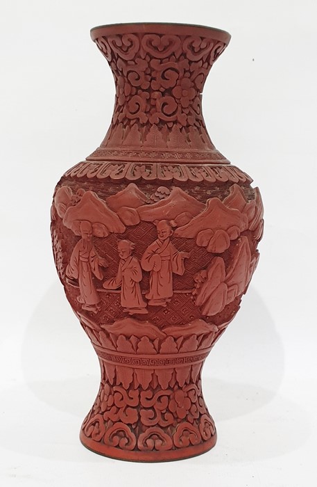Red cinnabar lacquer vase, relief decorated with figures in garden, 23cm high
