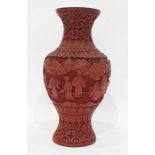 Red cinnabar lacquer vase, relief decorated with figures in garden, 23cm high