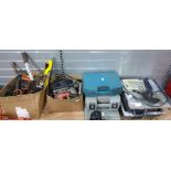 Collection of various power tools including bench tile cutter, drills, jigsaw, electric planer and