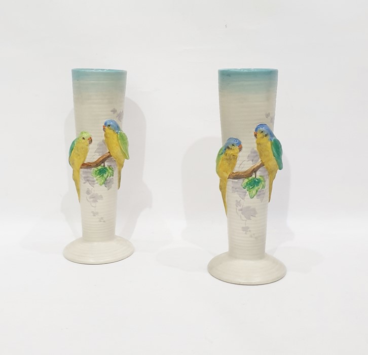 Pair of Clarice Cliff budgerigar applied tall pott