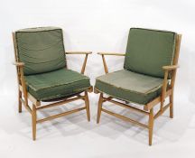 Two mid-20th century Ercol beech framed armchairs (2)Condition ReportOne of the chairs the webbing