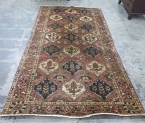 Persian rug, the red ground field with 18 interlin