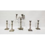 Four similar silver candlesticks of reeded design,