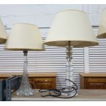 Two glass bodied table lamps, one with a clear gla