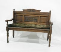 Oak bench with carved panel back, open arms, ring turned front legs Condition Reportimage as