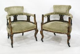 Pair of 19th century armchairs in striped upholstery, cabriole supports to castors (2)