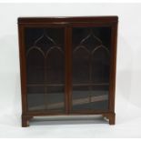 Early 20th century walnut glazed display cabinet with two astragal-glazed doors enclosing adjustable
