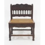 Anglo Indian style cane seated chair, the elaborately carved back and rail on barleytwist supports