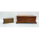 Oak box raised on bracket feet and an oak and inlaid tea caddy (2)