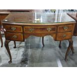 Early 20th century walnut bowfront desk with five assorted drawers, to cabriole supports, 105cm x