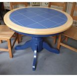 20th century blue tile-top beech-framed circular breakfast table, 106cm diameter