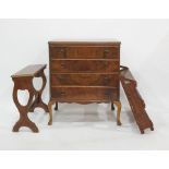 20th century walnut chest of four drawers raised on cabriole supports, an oak wall-hanging