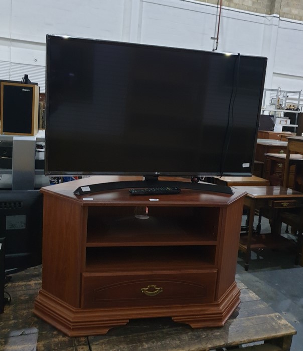LG 43" Ultra HD Smart TV, model No. 43UJ634V on wood effect TV stand