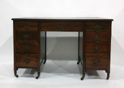 Early 20th century mahogany desk with green leatherette inset top, nine assorted drawers, raised