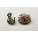 Marcasite and stained glass cat brooch and an Italian pietre dura brooch, oval with rose design