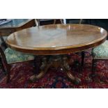 Victorian oval walnut centre table with applied moulded edge, birdcage type pedestal, to four