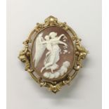 Carved shell cameo brooch with angel and putto in relief, oval and the gold-coloured metal mount,
