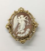Carved shell cameo brooch with angel and putto in relief, oval and the gold-coloured metal mount,