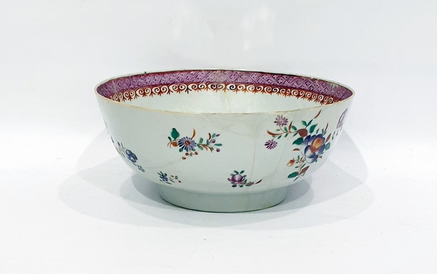 Chinese famille rose porcelain bowl with floral decoration and lattice work to border, 23cm diameter