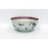 Chinese famille rose porcelain bowl with floral decoration and lattice work to border, 23cm diameter