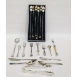 Set of six white metal Oriental cocktail spoons with various charm attachments to the handles, cased