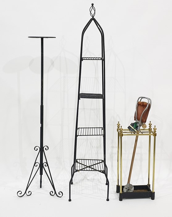 Assorted metalware to include brass umbrella stand, pan rack, adjustable torchere and a shooting
