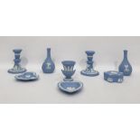 Various blue jasperware Wedgwood items, including pair of candlesticks, pair posy vases, two pin
