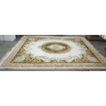 Modern cream ground rug with central brown ground medallion, brown ground spandrels, stepped border,