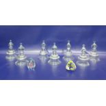 Set of seven glass inverse bell-shaped candle holders with a single gilt metal wall bracket and