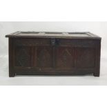 Possibly 17th century oak coffer with four diamond carved panels to the front, with iron lock and