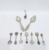 White metal souvenir spoon, six others, a small white metal Chinese pipe and a pair of tablespoon,