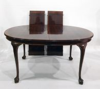 Early 20th century mahogany cross banded D-end extending table on cabriole supports, claw and ball
