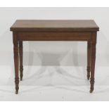 Late 19th/early 20th century folding card table on turned ring supports to brass caps and castors,