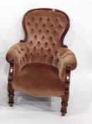 Victorian armchair in brown button-back upholstery, on turned front legs