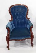 Victorian armchair in blue ground button-back upholstery, serpentine front rail, cabriole supports