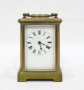 Brass carriage clock with Roman numerals to the enamel dial, 11cm high