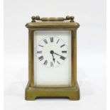 Brass carriage clock with Roman numerals to the enamel dial, 11cm high