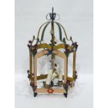 Metal hanging lamp decorated with free form flowers, in the shape of a lantern, with three lightbulb