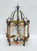 Metal hanging lamp decorated with free form flowers, in the shape of a lantern, with three lightbulb