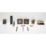 Assorted items to include playing cards, commemorative coins, pens, watches, etc