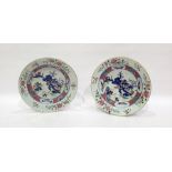 Pair of Chinese porcelain plates, each with lakeside landscape to centre and famille rose type