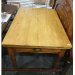 20th century pine plank top breakfast table with single drawer, raised upon turned supports 119.5