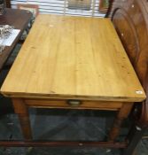 20th century pine plank top breakfast table with single drawer, raised upon turned supports 119.5