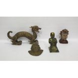 Metal figure of a praying Buddha, 25cm high, a balsa wood carved model of a dragon, a brass mask